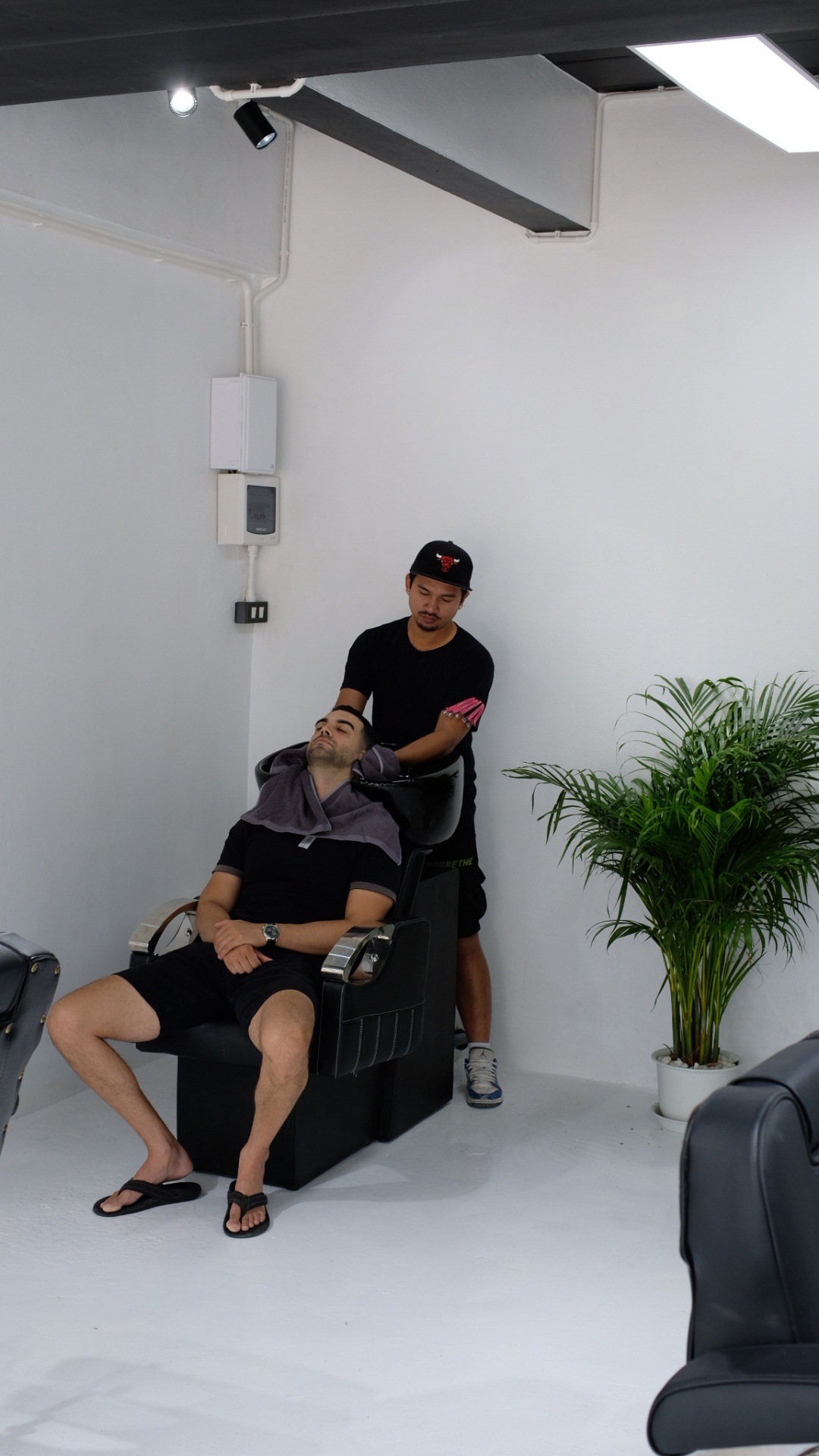 Hair wash station inside NextCut Barbershop