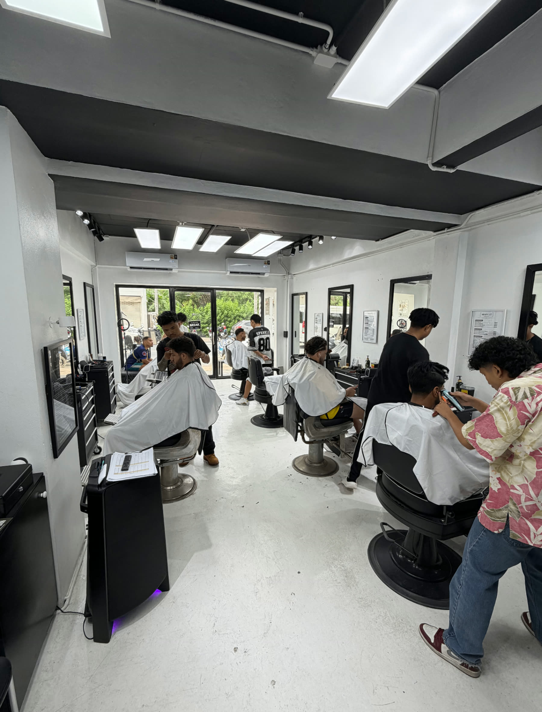 Barbershop interior with mirrors and chairs